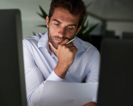 Shot of a young businessman working late at the office.